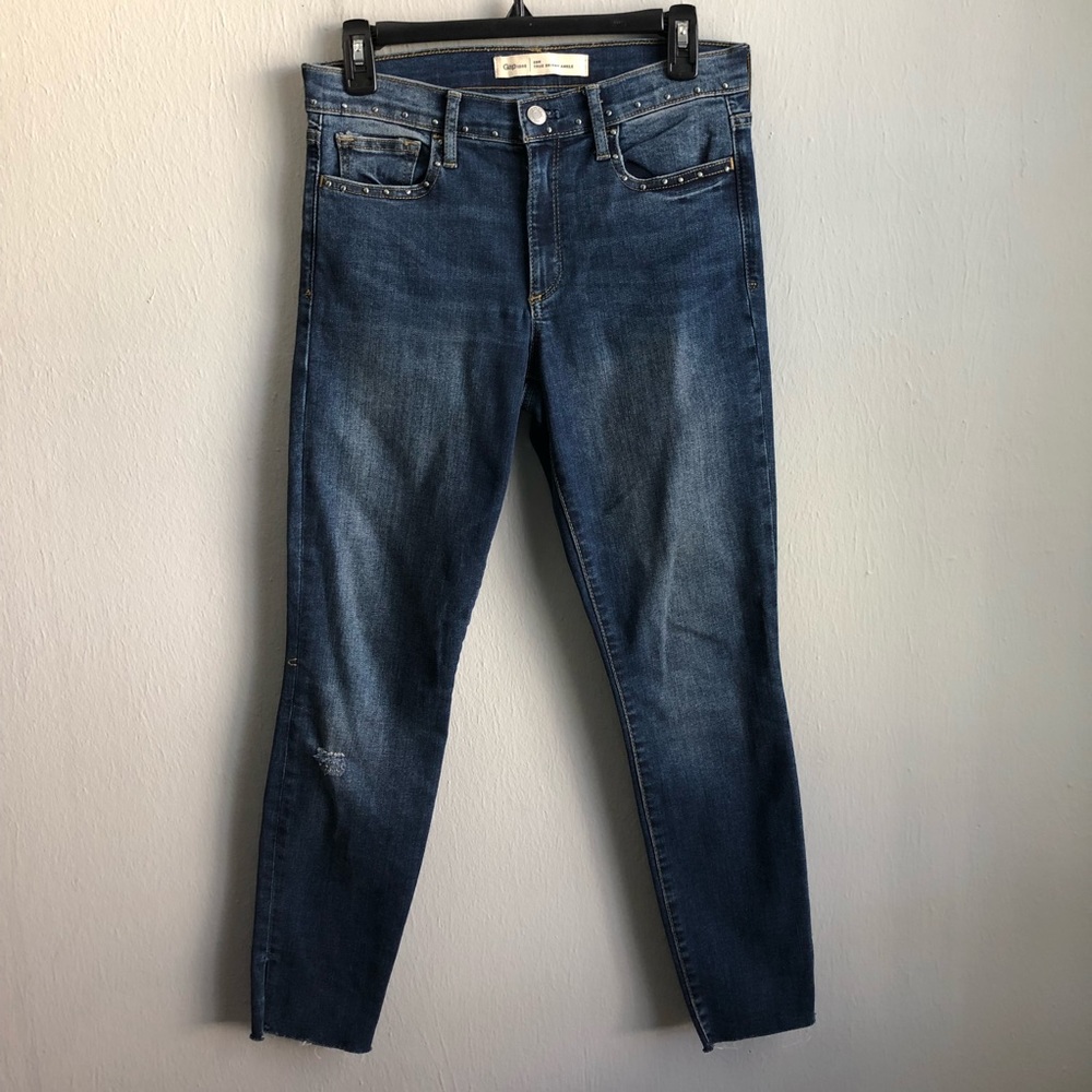 Gap true skinny ankle raw split hem studded jeans.